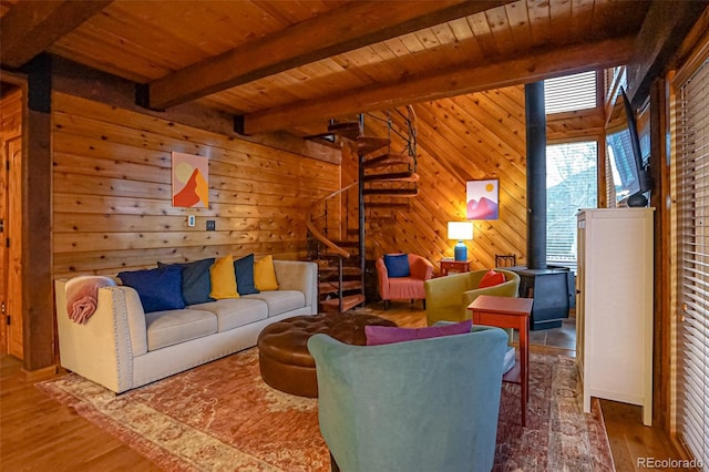 living room featuring hardwood / wood-style floors, wood walls, wooden ceiling, and beam ceiling