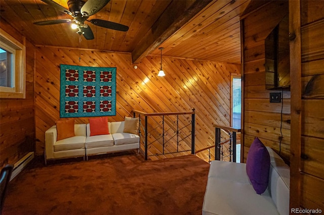 living area featuring beamed ceiling, carpet flooring, ceiling fan, and wooden walls