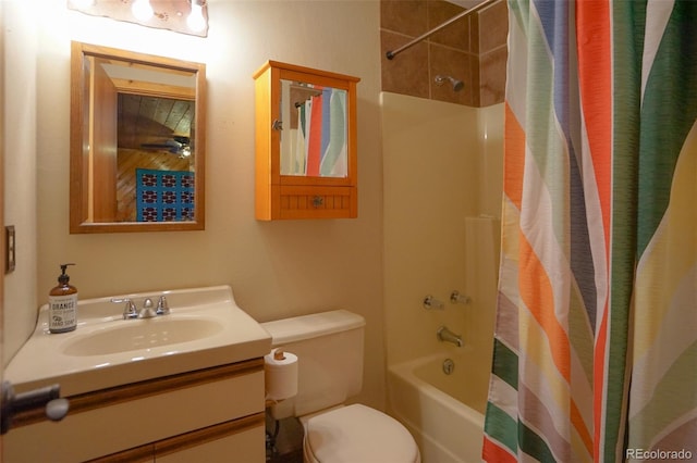 full bathroom with vanity, shower / bath combo, and toilet