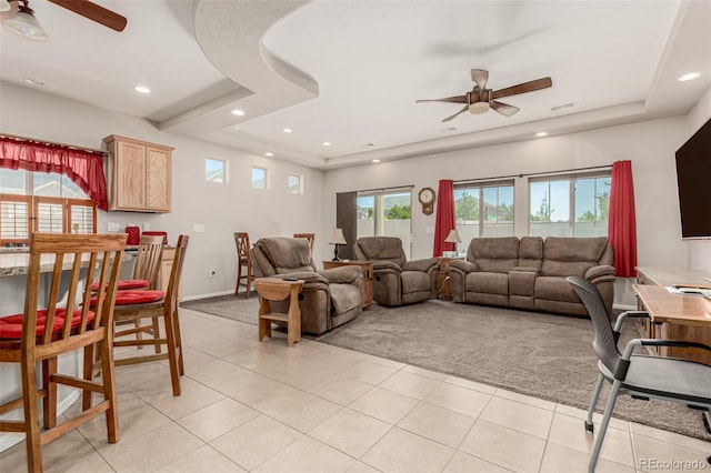 5568 Ceylon St, Denver, CO 80249 - living area featuring ceiling fan, light carpet, light tile patterned flooring, recessed lighting, and a tray ceiling