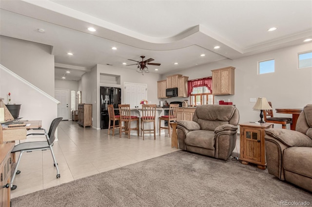 5568 Ceylon St, Denver, CO 80249 - living area featuring light tile patterned floors, recessed lighting, ceiling fan, and light carpet