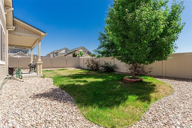 5568 Ceylon St, Denver, CO 80249 - fenced backyard featuring a patio
