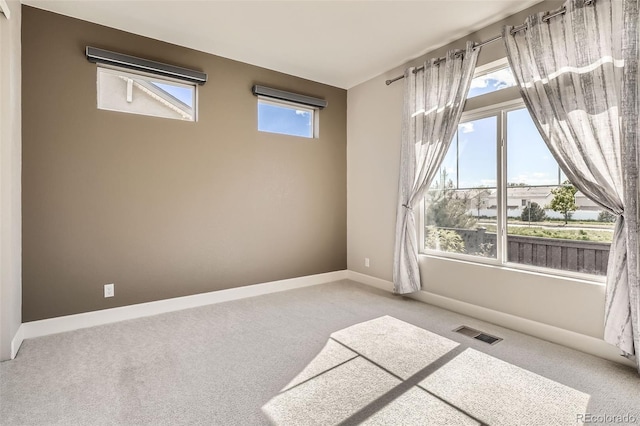 4955 N Picadilly Ct, Aurora, CO 80019 - carpeted empty room featuring baseboards
