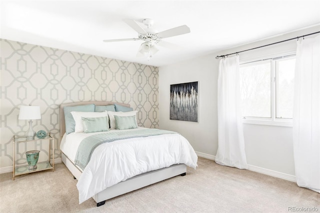 bedroom with baseboards, ceiling fan, carpet, and wallpapered walls