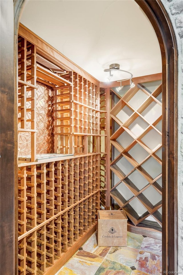 wine room featuring arched walkways