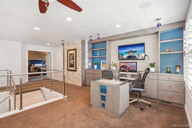 office space featuring ceiling fan and carpet