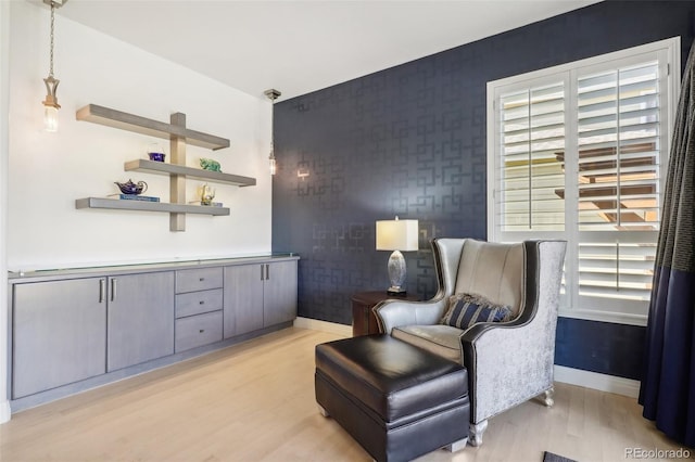 sitting room featuring light hardwood / wood-style flooring