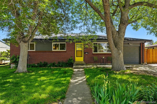 6088 Quail Ct, Arvada, CO 80004 - view of front of home with brick siding, an attached garage, entry steps, and driveway