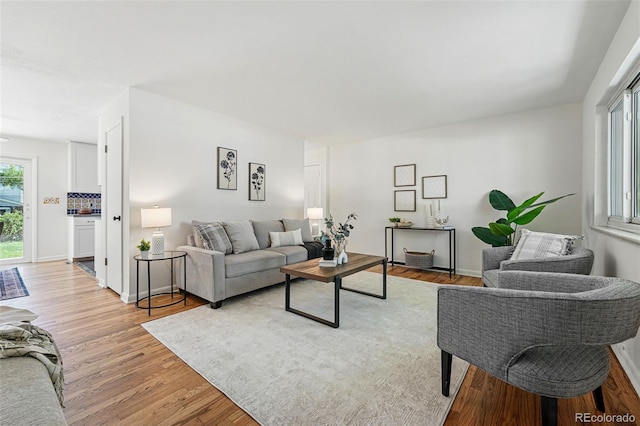 6088 Quail Ct, Arvada, CO 80004 - living area with light wood-style flooring and baseboards