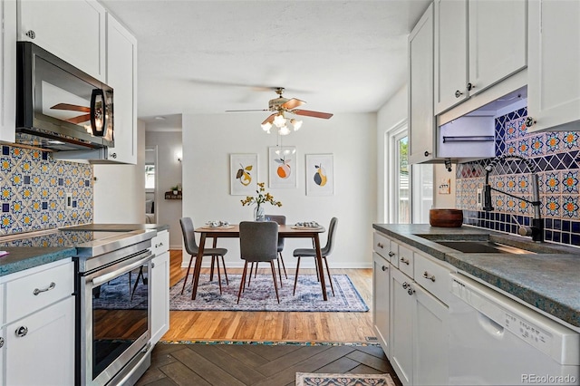 6088 Quail Ct, Arvada, CO 80004 - kitchen featuring black microwave, dishwasher, electric range, and dark countertops