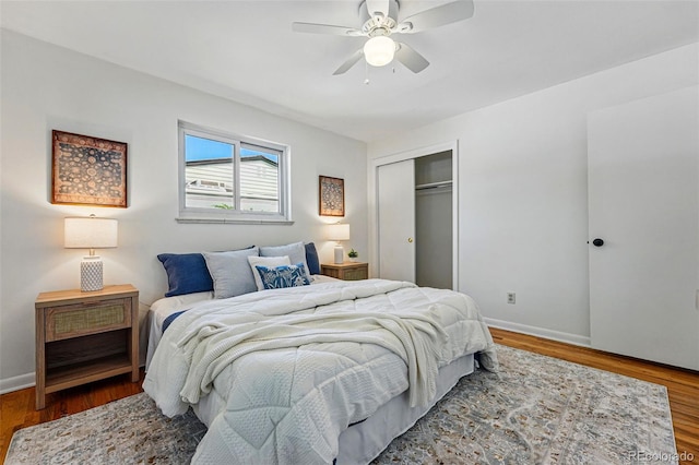 6088 Quail Ct, Arvada, CO 80004 - bedroom featuring wood finished floors, baseboards, and a closet