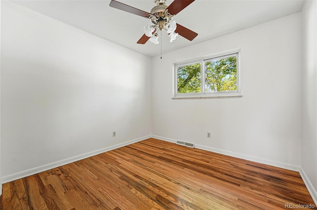 6088 Quail Ct, Arvada, CO 80004 - unfurnished room with baseboards, wood finished floors, and a ceiling fan