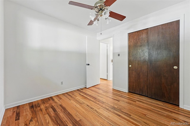 6088 Quail Ct, Arvada, CO 80004 - unfurnished bedroom featuring a closet, baseboards, wood finished floors, and ceiling fan