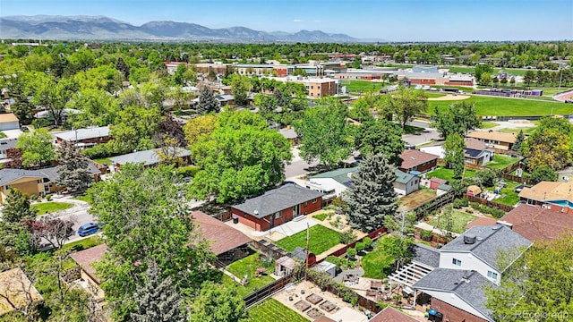 6088 Quail Ct, Arvada, CO 80004 - aerial perspective of suburban area with a mountain backdrop