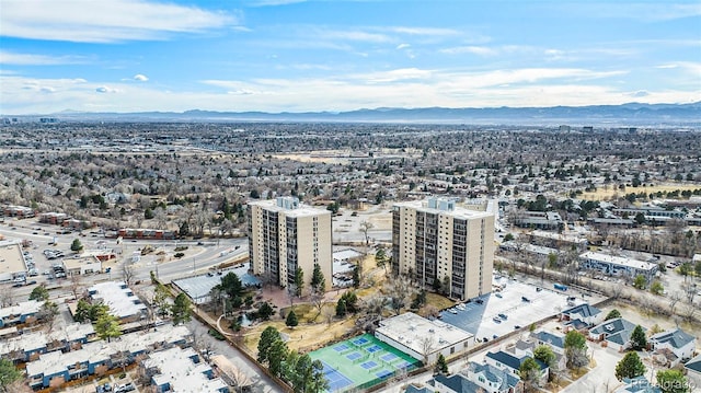 drone / aerial view with a mountain view and a city view