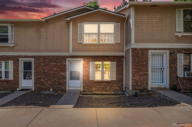 1534 S Ouray Cir Unit B, Aurora, CO 80017 - view of property featuring brick siding