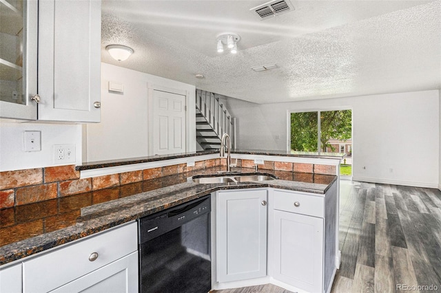 1534 S Ouray Cir Unit B, Aurora, CO 80017 - kitchen with black dishwasher, a sink, a textured ceiling, dark stone countertops, and white cabinets
