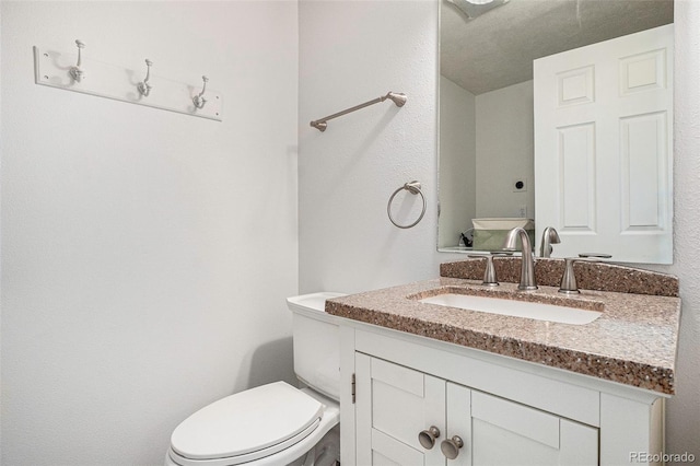 1534 S Ouray Cir Unit B, Aurora, CO 80017 - bathroom featuring vanity and toilet
