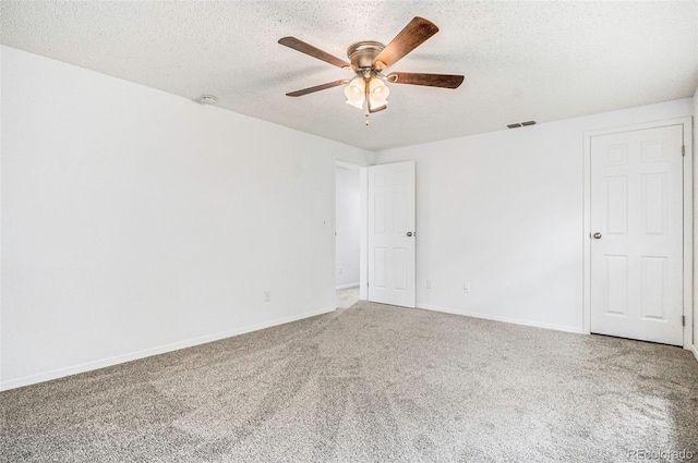 1534 S Ouray Cir Unit B, Aurora, CO 80017 - spare room featuring ceiling fan, carpet floors, baseboards, a textured ceiling, and a smoke detector