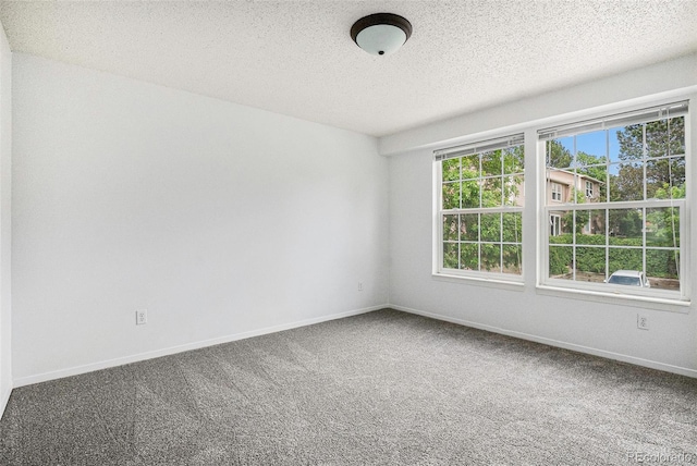 1534 S Ouray Cir Unit B, Aurora, CO 80017 - spare room featuring carpet, a textured ceiling, and baseboards