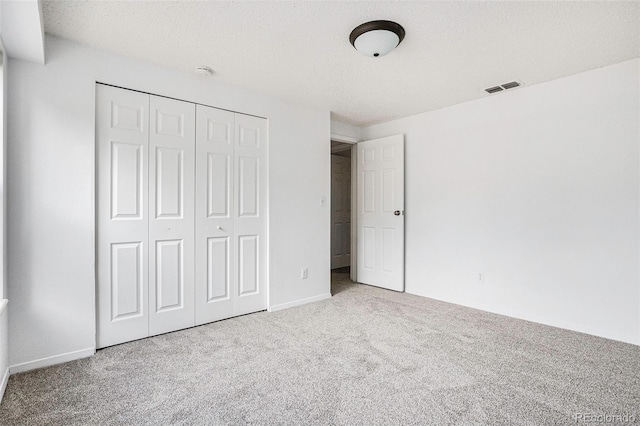 1534 S Ouray Cir Unit B, Aurora, CO 80017 - unfurnished bedroom featuring carpet, a closet, and baseboards