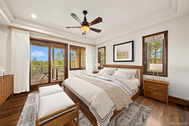 662 Yankakee Dr, Castle Rock, CO 80108 - bedroom featuring multiple windows, dark wood-style flooring, baseboards, and access to outside