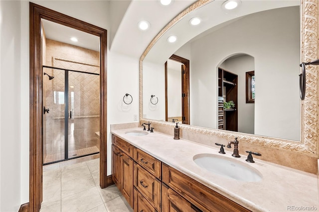 662 Yankakee Dr, Castle Rock, CO 80108 - bathroom featuring double vanity, a sink, a stall shower, and recessed lighting