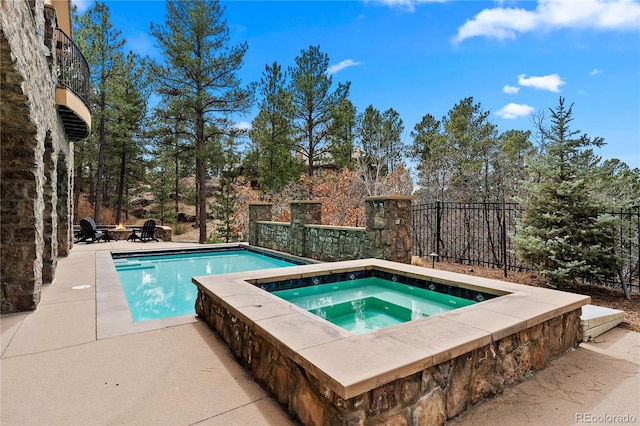 662 Yankakee Dr, Castle Rock, CO 80108 - pool with a patio, fence, and an in ground hot tub