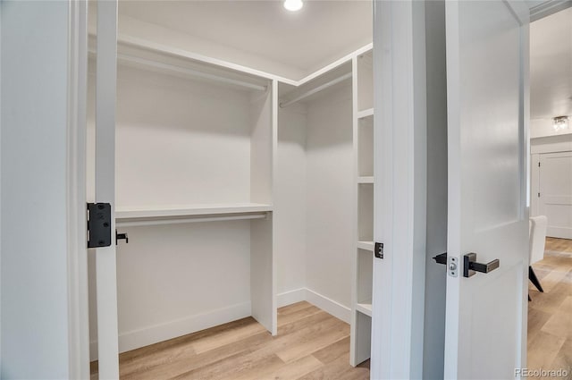 1308 Snowberry Ln Unit 303, Louisville, CO 80027 - spacious closet featuring wood finished floors