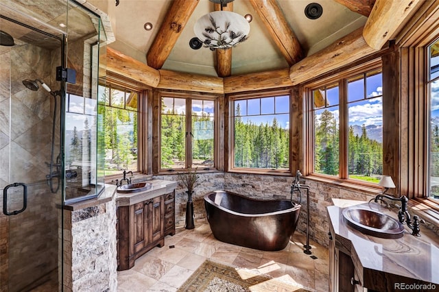 full bathroom with a wealth of natural light, beamed ceiling, a stall shower, and vanity