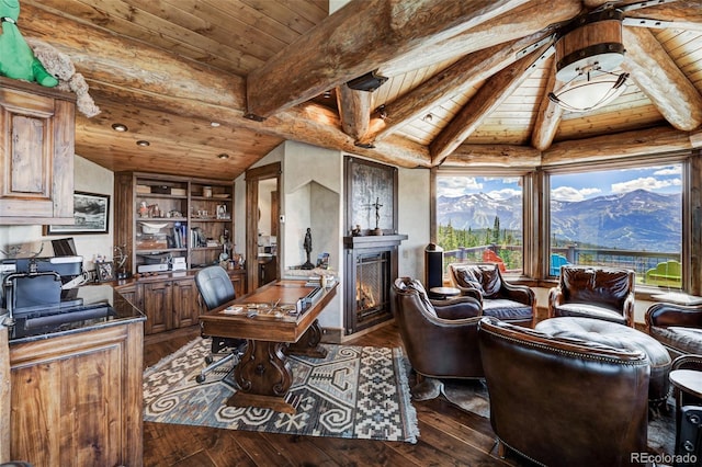 office area featuring wood ceiling, dark hardwood / wood-style floors, a mountain view, and vaulted ceiling with beams