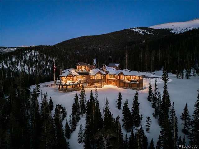 exterior space with a forest view and a mountain view