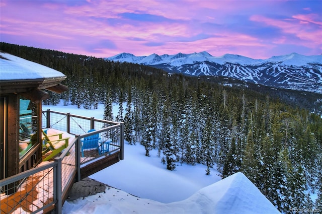 property view of mountains featuring a view of trees