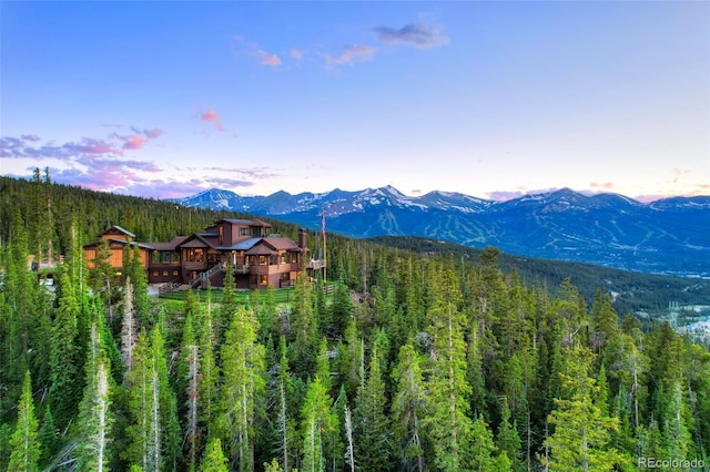 property view of mountains featuring a forest view