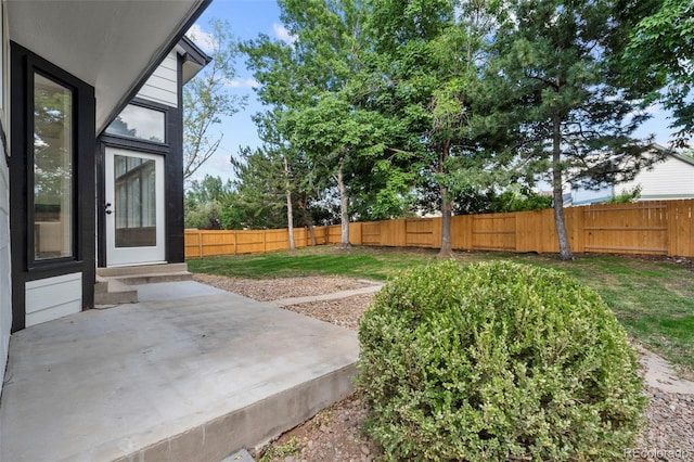 11260 W Fremont Ave, Littleton, CO 80127 - fenced backyard featuring a patio