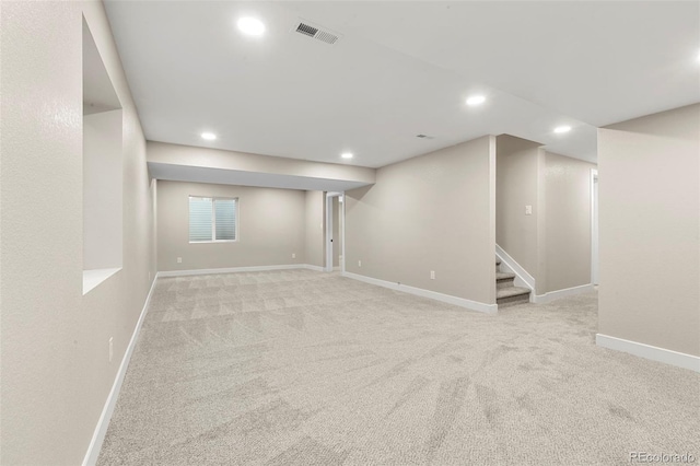 11260 W Fremont Ave, Littleton, CO 80127 - finished below grade area with recessed lighting, light carpet, and stairs