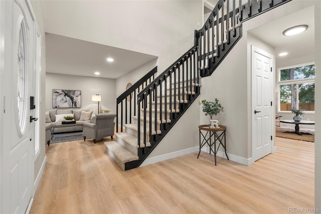 11260 W Fremont Ave, Littleton, CO 80127 - foyer entrance featuring light wood-style floors, stairway, and recessed lighting