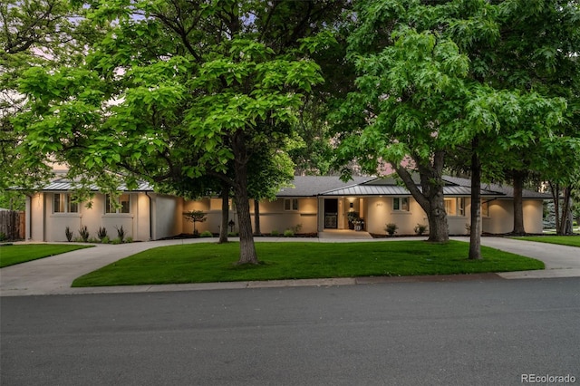 3901 S Dexter St, Cherry Hills Village, CO 80113 - view of front of home featuring curved driveway, stucco siding, and a standing seam roof