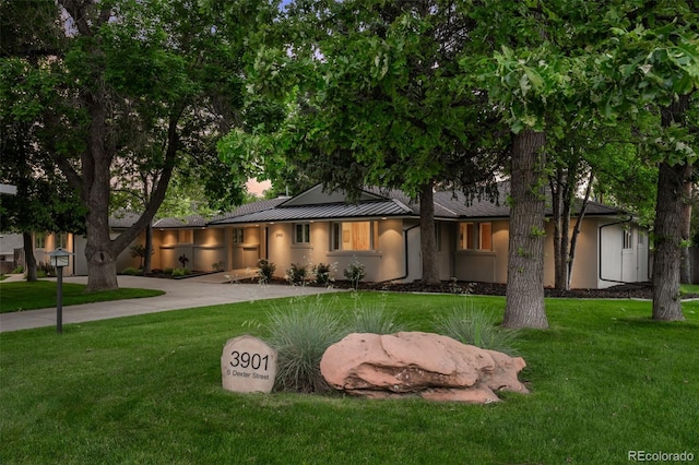 3901 S Dexter St, Cherry Hills Village, CO 80113 - view of front of home featuring a front yard, a standing seam roof, a metal roof, and stucco siding