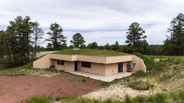 24130 High Timber Ln, Agate, CO 80101 - view of front of house with a patio area and stucco siding