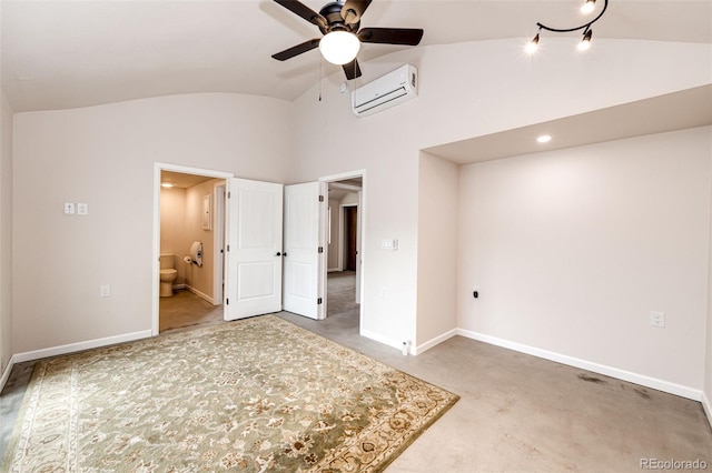 24130 High Timber Ln, Agate, CO 80101 - unfurnished bedroom with lofted ceiling, a wall mounted AC, connected bathroom, and baseboards