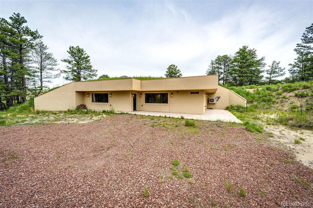 24130 High Timber Ln, Agate, CO 80101 - view of front facade with stucco siding and a patio