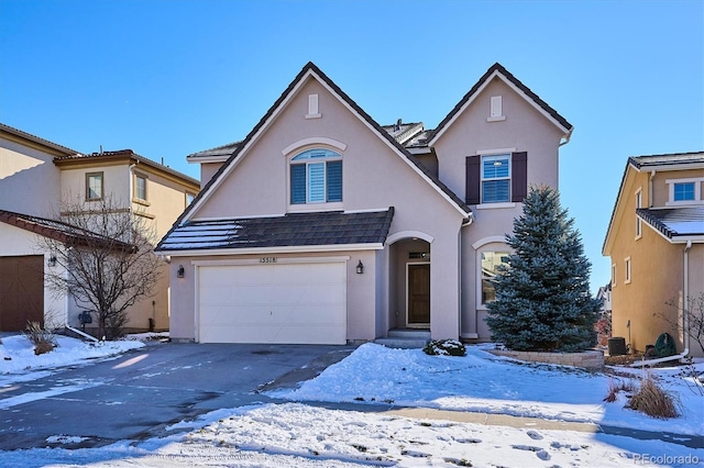 front facade with a garage