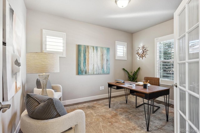 office featuring light wood-type flooring and french doors