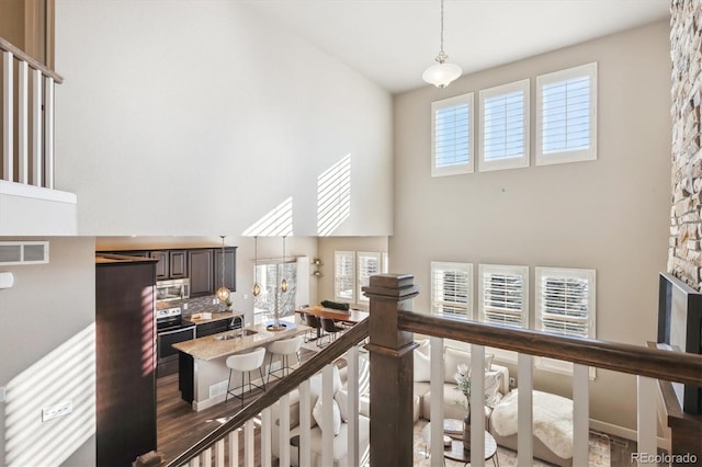 hall with a high ceiling and sink