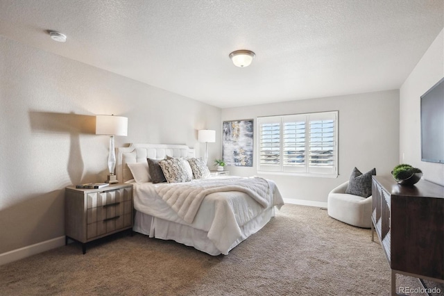 carpeted bedroom featuring a textured ceiling