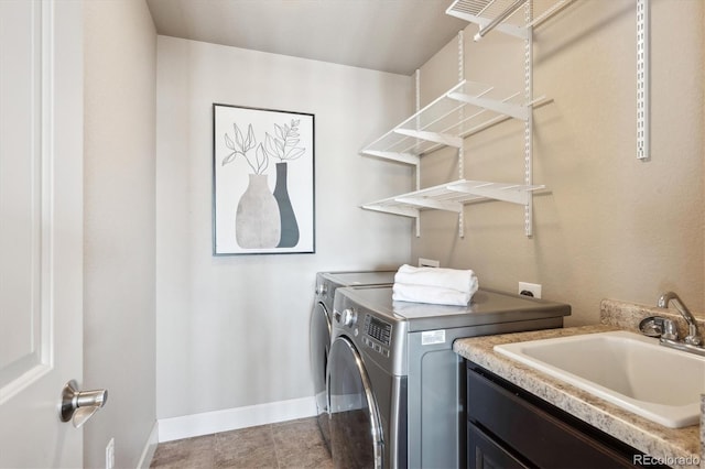 washroom featuring separate washer and dryer and sink