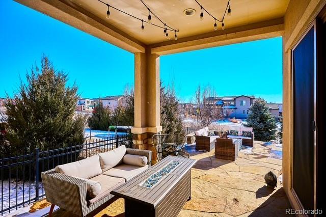 view of patio / terrace with an outdoor living space with a fire pit