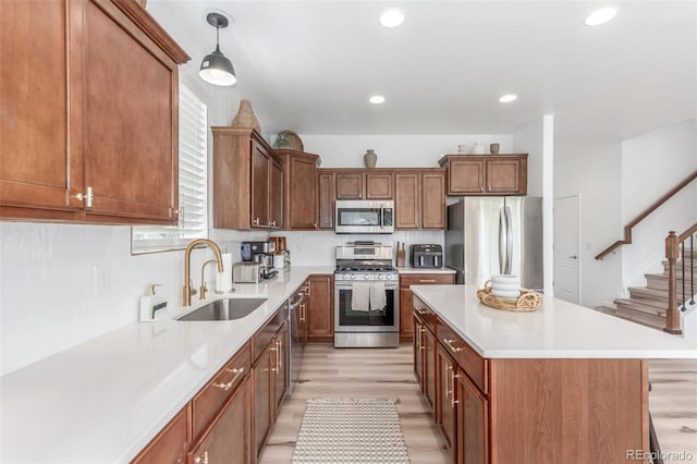 6400 S Ider St, Aurora, CO 80016 - kitchen featuring appliances with stainless steel finishes, light wood-style flooring, light countertops, recessed lighting, and decorative backsplash