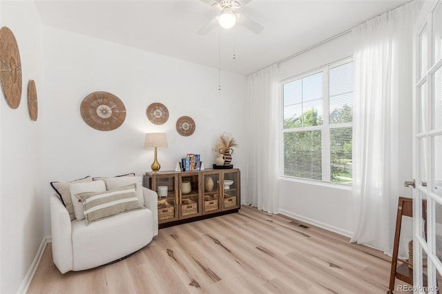 6400 S Ider St, Aurora, CO 80016 - sitting room with wood finished floors and ceiling fan